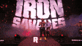 a man stands in front of a large screen that says iron sauvage