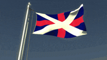 a flag with a red white and blue cross is flying in the wind