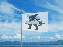 a flag with a picture of a monster on it is flying in the wind