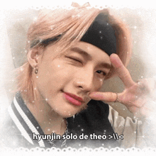 a picture of hyunjin solo de theo is surrounded by glitter