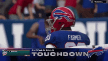 a buffalo bills player wearing a helmet and number 20 jersey