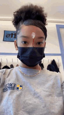 a girl wearing a gray shirt that says excel