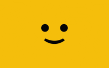 a yellow background with a black smiley face in the middle