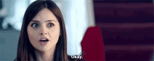 a woman is making a funny face and says `` okay '' .