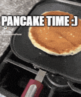 a pancake is being cooked on a pan with a caption that says pancake time