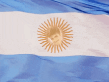 a blue and white flag with a picture of a man in the center