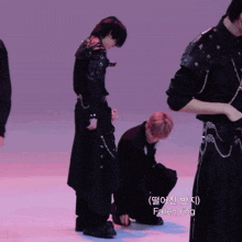 a man kneeling down with fallen ring written on the floor behind him