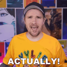 a man wearing a yellow shirt that says " actually "