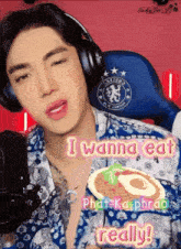 a man wearing headphones says i wanna eat phat-ka-phao really