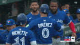 a blue jays player named bichette is hugging another player