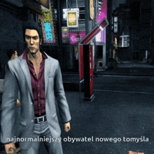 a man in a suit stands in front of a sign that says gerol on it