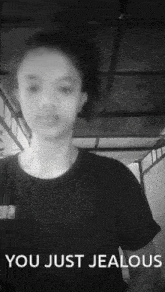 a black and white photo of a girl with the words " you just jealous " above her