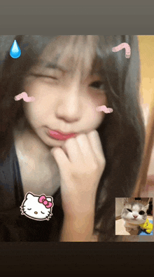 a girl with a hello kitty sticker on her top