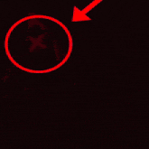 a red circle with an x in the middle of it