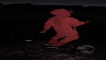 a blurry picture of a person laying on the ground in the dark