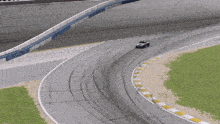 a race car is going around a curve on the track
