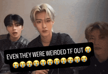 a sign that says " even they were weirded tf out " with crying faces on it
