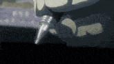 a close up of a person holding a pen with a metal tip