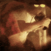 a blurry picture of a man holding a camera