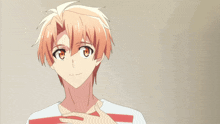 a boy with orange hair is holding out his hand with a heart in the background