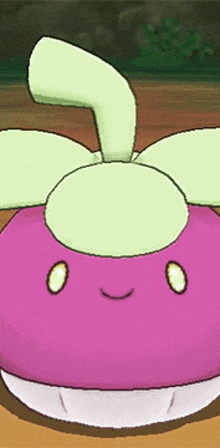 a pink cartoon character with a green leaf on top of it