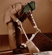 a man in a suit is sweeping the floor with ageofsam.io written on the bottom