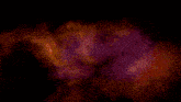 a close up of a demon with glowing red eyes