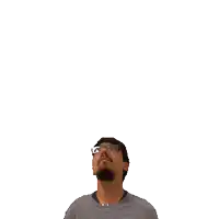 a man with a beard and glasses is looking up at the number 20