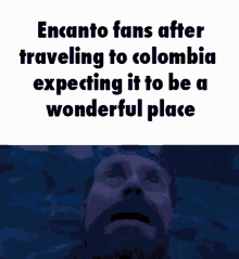 a man with a beard is looking up at the sky with the words encanto fans after traveling to colombia