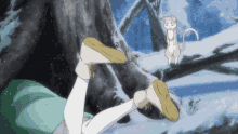 a person laying on their stomach in the snow with a white cat flying in the background