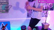 a man is kneeling down in front of a screen that says 15:06