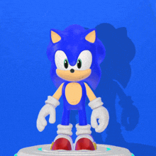 a blue and yellow sonic the hedgehog standing on a blue background