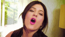 a close up of a woman yawning with her mouth wide open