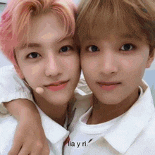 two young men are posing for a picture and the words lia y ri are on the bottom