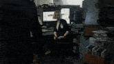 a woman in a cubicle with a name tag that says ' a.c. '