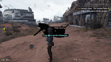 a screenshot of a video game shows a person carrying a weapon and a message that says press to use the holotracker
