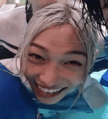 a close up of a person 's face in a swimming pool .
