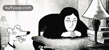 a black and white cartoon of a woman sitting at a desk with a lamp and a dog standing next to her ..