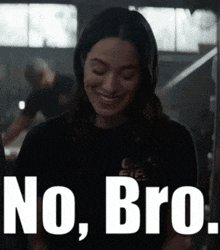 a woman is smiling and wearing a black shirt with the words no bro on it .