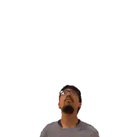 a man with a beard and glasses looks up at the number 12