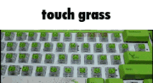 a keyboard with green keys and the words touch grass on the top