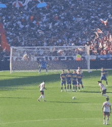 a group of soccer players on a field in front of a banner that says ' be '