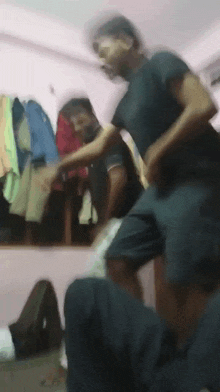 a blurry photo of a man dancing in a room