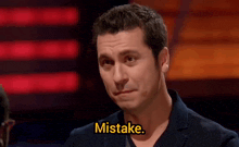 a man is making a face and the word mistake is on the bottom