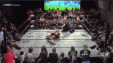 a wrestling ring with jcw written on the bottom