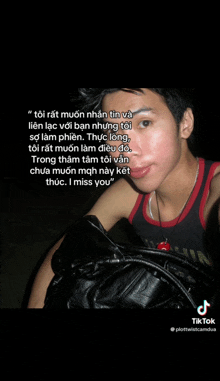 a young man taking a selfie with a quote in the background that says i miss you