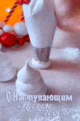 a christmas greeting card with a person piping white frosting