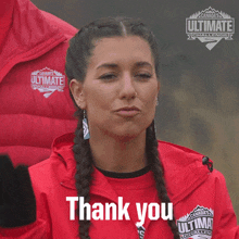 a woman wearing a red shirt that says canada 's ultimate challenge on it