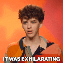 a young man says it was exhilarating on a red background