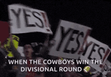 a group of people are holding up signs that say yes when the cowboys win the divisional round